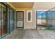 Private patio with secure iron bars and a wooden floor, perfect for enjoying the outdoors at 1160 S Clinton St # 40, Denver, CO 80247