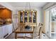 Comfortable dining area featuring natural light and a stylish chandelier above the glass table at 8822 Fiesta Ter, Lone Tree, CO 80124