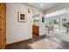 Inviting foyer with tile flooring, wood accents, and an open view to the kitchen and dining area at 8822 Fiesta Ter, Lone Tree, CO 80124