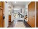 Inviting foyer with tile flooring, wood accents, and an open view to the living spaces at 8822 Fiesta Ter, Lone Tree, CO 80124