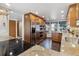 Well-lit kitchen with stainless steel appliances, granite countertops and wood cabinetry at 8822 Fiesta Ter, Lone Tree, CO 80124