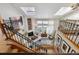 Open floor plan with skylights, iron railing, and a fireplace feature in the living space at 8822 Fiesta Ter, Lone Tree, CO 80124