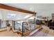 Open loft area with skylights and iron railing overlooking the living space below at 8822 Fiesta Ter, Lone Tree, CO 80124