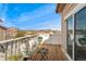 Relaxing balcony with stylish seating, overlooking the neighborhood and bright blue sky at 6819 S Webster St # E, Littleton, CO 80128