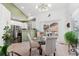 Open concept dining area adjacent to the kitchen with a view of the balcony at 6819 S Webster St # E, Littleton, CO 80128
