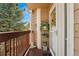 A cozy front porch with a decorated door, offering a warm welcome to this charming home at 6819 S Webster St # E, Littleton, CO 80128
