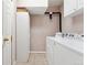 Well-maintained laundry room with a washer, dryer, and storage space at 6819 S Webster St # E, Littleton, CO 80128