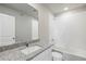Bathroom featuring granite countertops, white cabinets, and tile flooring at 7303 Dolores Ave, Frederick, CO 80530