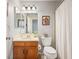 Bathroom offers bright lighting and neutral tones throughout at 3600 S Pierce St # 1-207, Denver, CO 80235