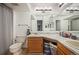 Bathroom features dual sinks, nice lighting, and good storage at 3600 S Pierce St # 1-207, Denver, CO 80235