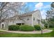 Charming exterior view of a gray two-story condo with well-maintained landscaping at 3600 S Pierce St # 1-207, Denver, CO 80235