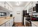 Bright kitchen features stainless steel appliances and updated lighting at 3600 S Pierce St # 1-207, Denver, CO 80235