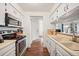 Efficient kitchen featuring white cabinetry, stainless steel appliances, and practical layout at 3600 S Pierce St # 1-207, Denver, CO 80235