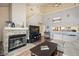 Inviting living room with vaulted ceilings, stone fireplace, and open layout into the kitchen at 3600 S Pierce St # 1-207, Denver, CO 80235