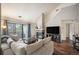 Comfortable living room with sliding door to the exterior and a cozy stone fireplace at 3600 S Pierce St # 1-207, Denver, CO 80235