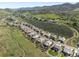 Picturesque aerial view of the neighborhood, highlighting the homes and the surrounding green landscape at 4868 Hogback Ridge Rd, Morrison, CO 80465