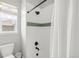 Bright bathroom with a toilet and a shower/bathtub that is equipped with black showerhead at 4868 Hogback Ridge Rd, Morrison, CO 80465