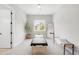 Bright room with a window, a large mirror and a massage bed with black padding at 4868 Hogback Ridge Rd, Morrison, CO 80465