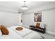 Calm, neutral bedroom with a comfortable bed, bench, and stylish decorative touches at 4868 Hogback Ridge Rd, Morrison, CO 80465