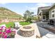 Enjoy the outdoors with this beautiful stone fire pit and seating in the backyard at 4868 Hogback Ridge Rd, Morrison, CO 80465