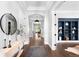 Bright foyer showcases hardwood floors, an arched ceiling detail, and a view of the backyard oasis at 4868 Hogback Ridge Rd, Morrison, CO 80465