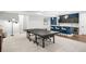 Game room with a ping pong table and bar with seating, perfect for entertaining guests at 4868 Hogback Ridge Rd, Morrison, CO 80465