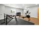 Home gym features modern equipment with durable flooring and a bright window at 4868 Hogback Ridge Rd, Morrison, CO 80465