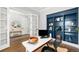 Bright office featuring a large work space, custom shelving, and decor at 4868 Hogback Ridge Rd, Morrison, CO 80465