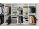 A beautiful and organized walk-in closet with custom shelving and ample storage space at 4868 Hogback Ridge Rd, Morrison, CO 80465