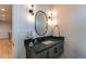 Chic powder room with a modern vanity, elegant lighting, and a sleek black faucet at 8 S Colorado Blvd, Denver, CO 80246