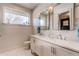 Bright bathroom with double sinks, modern fixtures, and a large window at 8 S Colorado Blvd, Denver, CO 80246