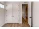 Bright bedroom features stylish wood floors, neutral walls, and a closet with double doors at 8 S Colorado Blvd, Denver, CO 80246