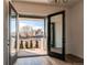 Inviting entryway with modern double doors leading to a covered porch and light wood floors at 8 S Colorado Blvd, Denver, CO 80246