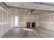Spacious garage with a modern door, high ceilings and access door to the side of the home at 8 S Colorado Blvd, Denver, CO 80246