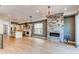 Open living space with modern fireplace and seamless flow to dining area and kitchen at 8 S Colorado Blvd, Denver, CO 80246