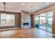 Bright living room with a modern fireplace, hardwood floors, and sliding glass doors at 8 S Colorado Blvd, Denver, CO 80246
