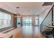 Spacious living room featuring a fireplace, hardwood floors, and modern light fixtures at 8 S Colorado Blvd, Denver, CO 80246