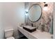 Chic powder room with a modern sink, stylish lighting, and decorative mirror at 8 S Colorado Blvd, Denver, CO 80246