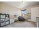 Bedroom with toy kitchen, beanbag, shelves with books and view of the community clubhouse at 4730 Copeland Cir # 203, Highlands Ranch, CO 80126