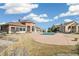 Community clubhouse and pool with seating and grassy area on a sunny day at 4730 Copeland Cir # 203, Highlands Ranch, CO 80126