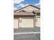 Attached garage with neutral door, complementary trim, and a 'No Parking Fire Lane' sign to ensure safety at 4730 Copeland Cir # 203, Highlands Ranch, CO 80126