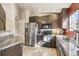 Modern kitchen featuring stainless steel appliances, granite countertops, and ample cabinet space at 4730 Copeland Cir # 203, Highlands Ranch, CO 80126