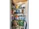 A storage closet full of boxes and other items on wire shelving with a floor lamp at 4730 Copeland Cir # 203, Highlands Ranch, CO 80126