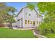 Back exterior view of a well-maintained home with a spacious yard and a charming patio at 5206 S Meadow Lark Dr, Castle Rock, CO 80109