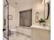 Modern bathroom featuring a glass-enclosed shower, sleek vanity, and contemporary fixtures at 5206 S Meadow Lark Dr, Castle Rock, CO 80109
