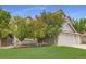 Beautiful home with a well-manicured lawn and mature trees in a peaceful neighborhood at 5206 S Meadow Lark Dr, Castle Rock, CO 80109
