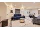 Cozy living room with plush blue sofa, patterned rug, and stylish decor for a relaxed atmosphere at 5206 S Meadow Lark Dr, Castle Rock, CO 80109