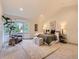 Spacious main bedroom with a cozy sitting area and ample natural light from bay windows at 5206 S Meadow Lark Dr, Castle Rock, CO 80109