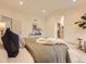 Serene main bedroom with a cozy rug and decor and an ensuite bathroom at 5206 S Meadow Lark Dr, Castle Rock, CO 80109