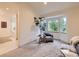 A cozy sitting area with a view of the bay windows in the main bedroom with attached ensuite bathroom at 5206 S Meadow Lark Dr, Castle Rock, CO 80109